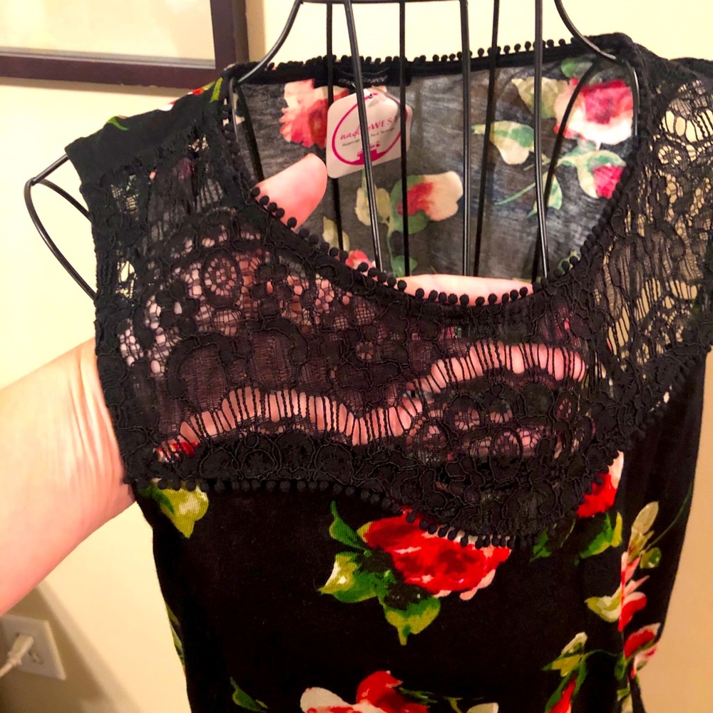 Sleeveless dainty top with lace across the chest